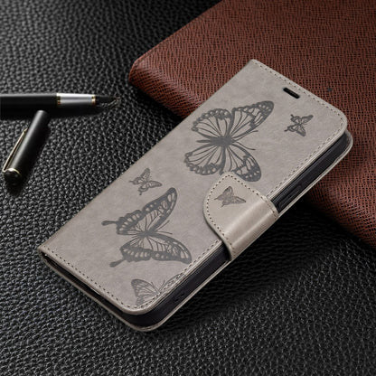 For iPhone 16 Embossing Two Butterflies Pattern Leather Phone Case(Grey) - iPhone 16 Cases by PMC Jewellery | Online Shopping South Africa | PMC Jewellery | Buy Now Pay Later Mobicred