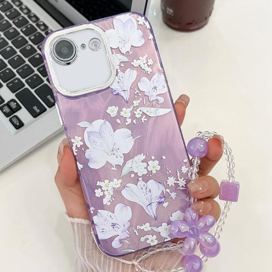 For iPhone 16e Electroplating Flowers Plants Texture Wristband TPU Phone Case(Pale Purple FlowerFL11) - iPhone 16e Cases by PMC Jewellery | Online Shopping South Africa | PMC Jewellery | Buy Now Pay Later Mobicred