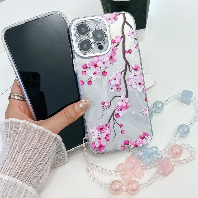 For iPhone 16e Electroplating Flowers Plants Texture Wristband TPU Phone Case(Plum Flower FL6) - iPhone 16e Cases by PMC TechLife | Online Shopping South Africa | PMC TechLife | Buy Now Pay Later Mobicred